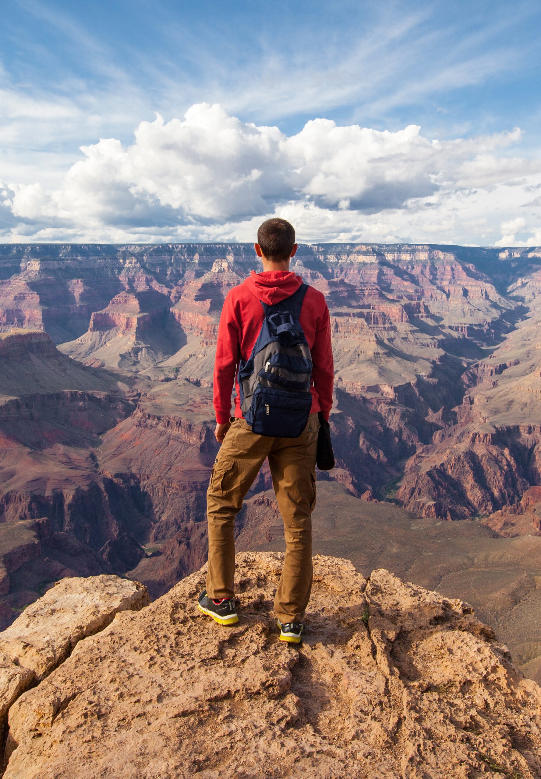 Travel in Grand Canyon, man Hiker with backpack enjoying view, USA